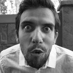 a man making a playful face, labeled as Book Aficionado